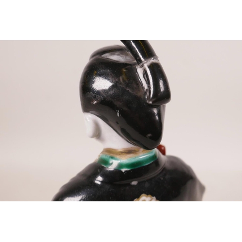 497 - A Japanese porcelain figure in a black robe, A/F repair, 10