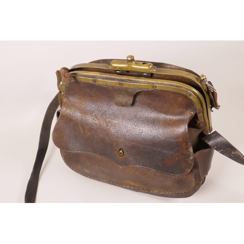 5 - A C19th leather fisherman's bag with brass clasp, 10