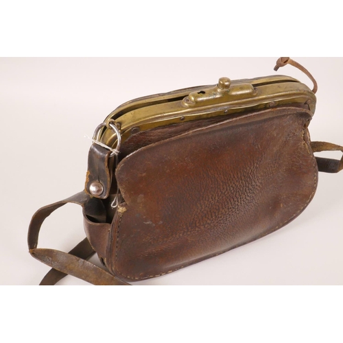 5 - A C19th leather fisherman's bag with brass clasp, 10