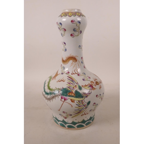 500 - A Chinese polychrome porcelain garlic head shaped vase, with enamel decoration of a dragon and phoen... 