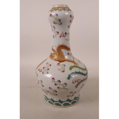 500 - A Chinese polychrome porcelain garlic head shaped vase, with enamel decoration of a dragon and phoen... 