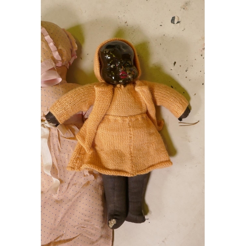 51 - An early C20th black doll with composition head 14