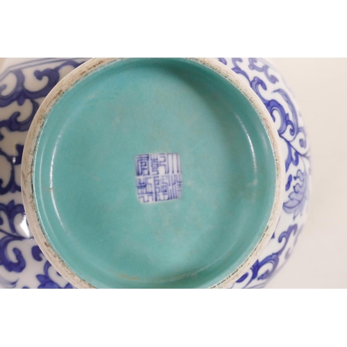 510 - A Chinese blue and white porcelain bowl with polychrome decorative panels depicting birds amongst fl... 