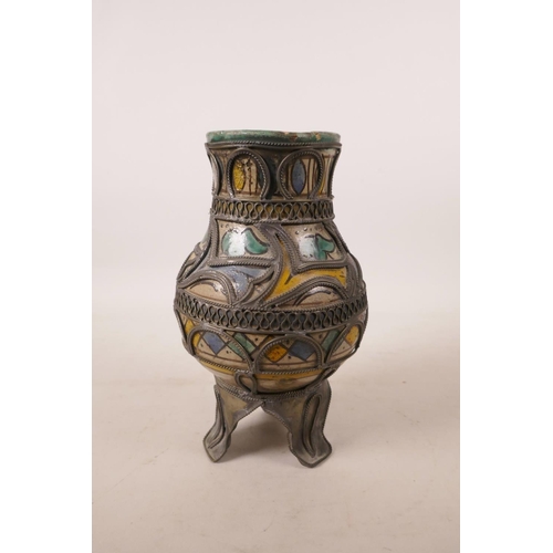 517 - A North African pottery ewer with metal mounts, A/F repair to rim, 7½