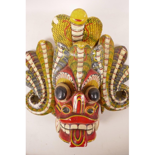 524 - A vintage Sri Lankan Maha Kola mask, with polychrome decoration, probably first half of the C20th, 1... 