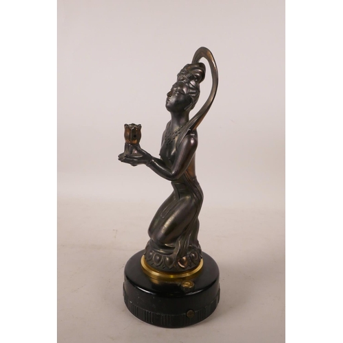 538 - A Japanese figural table lighter in the form of a kneeling Oriental woman, 11