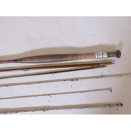 54 - Two vintage three section fly fishing rods, one wooden and one metal