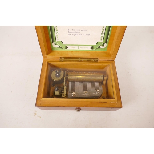 544 - A walnut cased Swiss music box, 5½