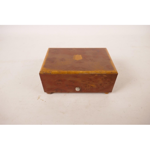 544 - A walnut cased Swiss music box, 5½