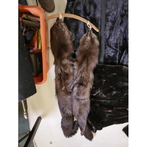 556 - Two Astraka faux fur full length coats, together with another faux fur collarless coat and a twin fo... 