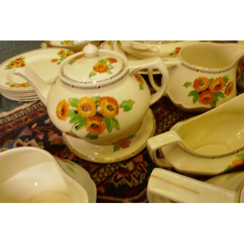 560 - An extensive vintage Art Deco Crown Ducal Marigold pattern dinner, tea and breakfast service compris... 