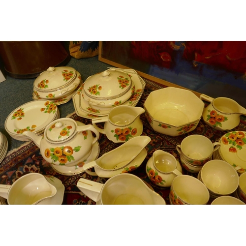 560 - An extensive vintage Art Deco Crown Ducal Marigold pattern dinner, tea and breakfast service compris... 