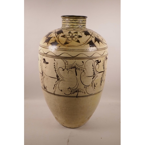 572 - A Chinese Cizhou kiln pottery vase with scrolling floral decoration, circa C12th-14th, A/F repairs, ... 