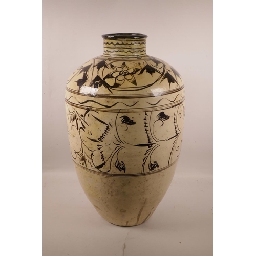 572 - A Chinese Cizhou kiln pottery vase with scrolling floral decoration, circa C12th-14th, A/F repairs, ... 