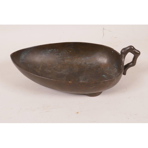 575 - A Chinese bronze leaf shaped pourer, 7½