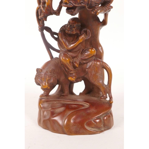 58 - A Chinese boxwood carving depicting two Lohan riding a dragon and tiger, 7