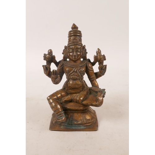 61 - An Indian bronze of a many armed deity, 4½