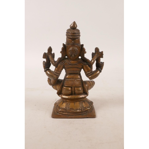 61 - An Indian bronze of a many armed deity, 4½