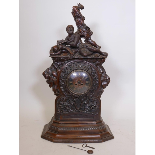 611 - A C19th Black Forest walnut bracket clock, with carved decoration of oak and acorns under a figure g... 