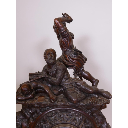 611 - A C19th Black Forest walnut bracket clock, with carved decoration of oak and acorns under a figure g... 