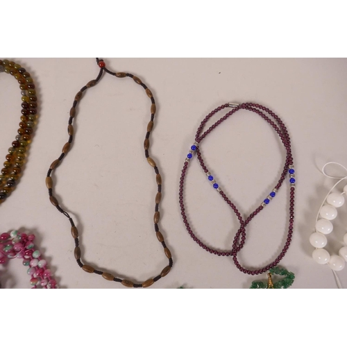 618 - A quantity of costume jewellery necklaces to include jade, agate, hardstone etc