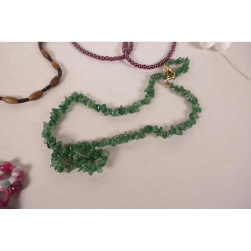 618 - A quantity of costume jewellery necklaces to include jade, agate, hardstone etc