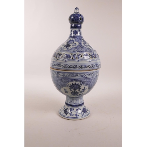 65 - A Chinese blue and white porcelain censer with a pierced cover and decorative floral panels, 6 chara... 