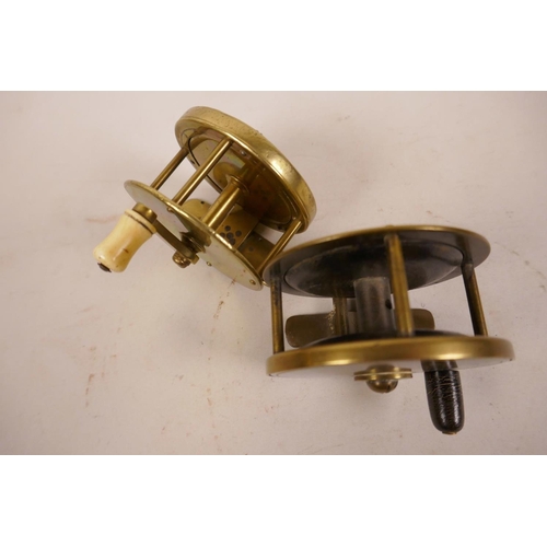 72 - Two early brass trout fishing reels, 2¾