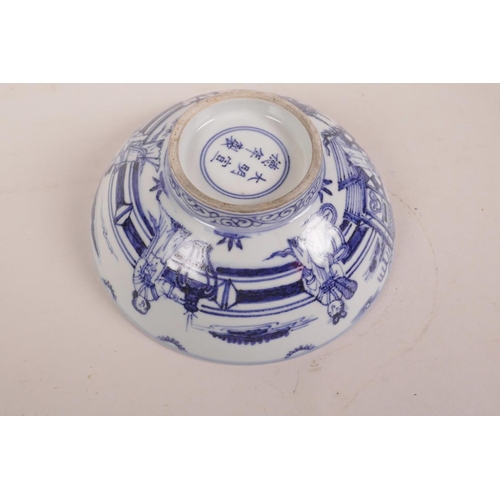 75 - A Chinese blue and white porcelain bowl decorated with figures in a garden, 6 character mark to base... 