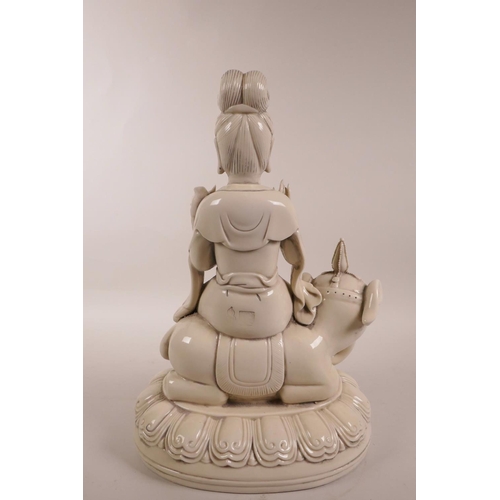 88 - A Chinese blanc de chine figure of Quan Yin seated on an elephant, seal marks verso, 12½