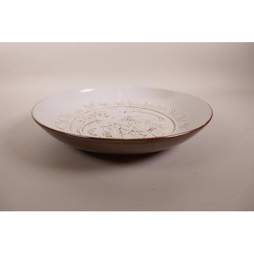 90 - A Chinese porcelain charger with raised decoration of Asiatic birds to the bowl and a copper glazed ... 