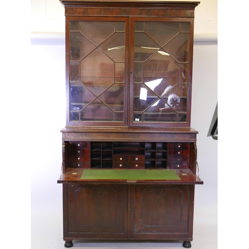 1105 - A C19th mahogany secretaire bookcase in the style of Gillow, with astragal glazed top over a fitted ... 