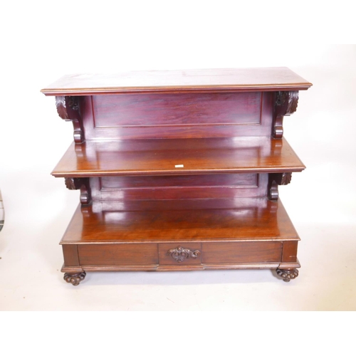 1131 - A Vicotorian mahogany three tier buffet with scrolled supports, single frieze drawer, and gadrooned ... 