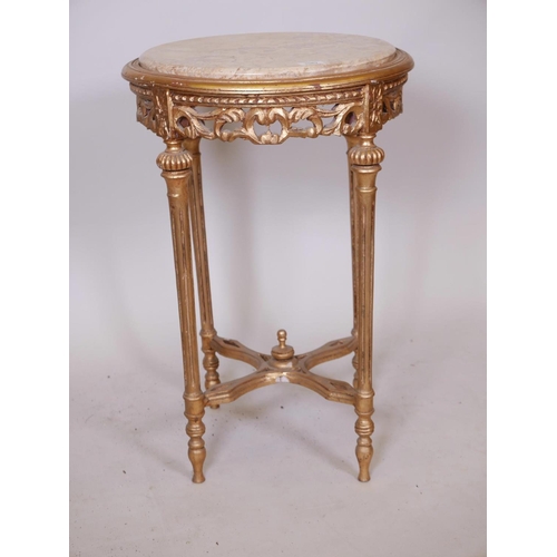 1133 - A Louis XV style giltwood occasional table with carved pierced frieze, fluted supports, pierced stre... 