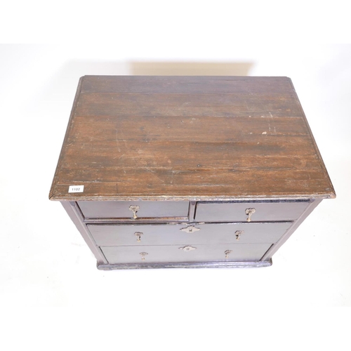 1102 - A C19th pine Lincolnshire dresser with seven drawers flanking a central cupboard, 62