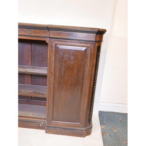 1090 - A Victorian walnut breakfront low bookcase, with ebonised and parcel gilt decoration in the Aestheti... 