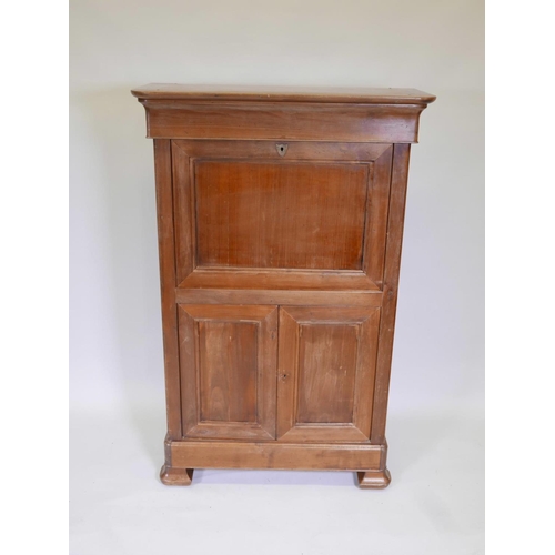 1094 - A French fruitwood secretaire à abattant, with shaped frieze drawer over a fitted fall and two cupbo... 