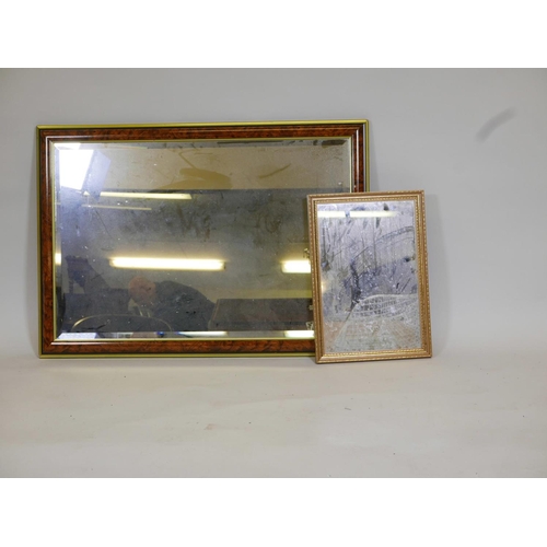 1096 - A large walnut style bevelled glass mirror, together with a smaller mirror, 28