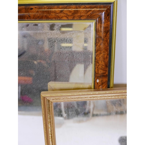 1096 - A large walnut style bevelled glass mirror, together with a smaller mirror, 28