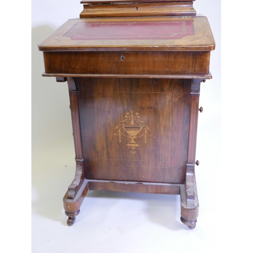 1099 - A Victorian inlaid figured walnut davenport, with four true and four false drawers, A/F, 21