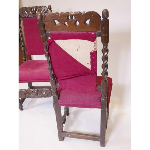 1104 - A pair of C17th/18th oak high back side chairs with carved coronets to back rail and stretcher, 44