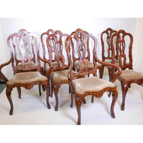 1108 - A set of eight (six and two) Dutch inlaid walnut chairs, with pierced splat backs on shaped supports... 