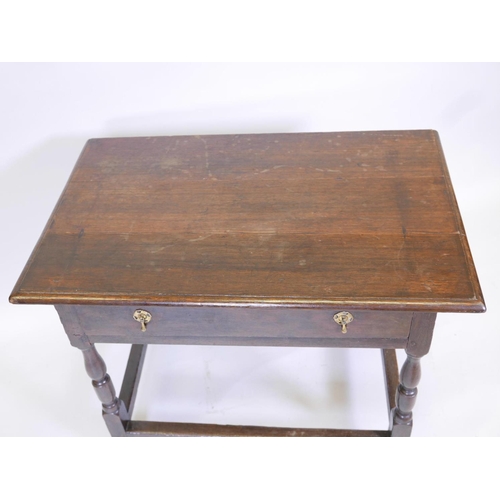 1109 - A William and Mary oak side table with a single drawer, raised on turned supports, 362 x 23