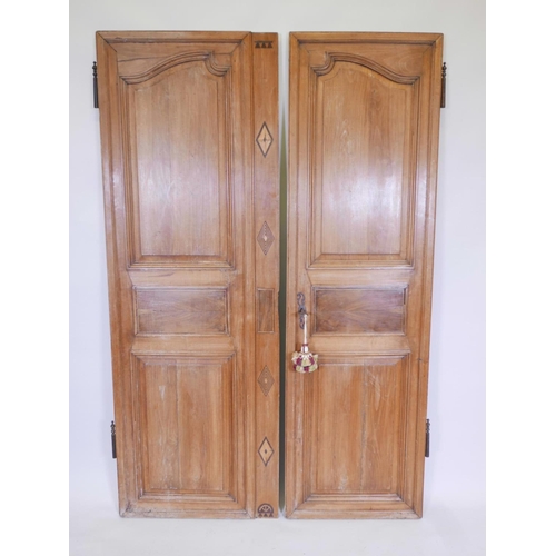 1111 - A pair of French walnut armoire doors, comes with lock and key