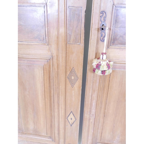 1111 - A pair of French walnut armoire doors, comes with lock and key