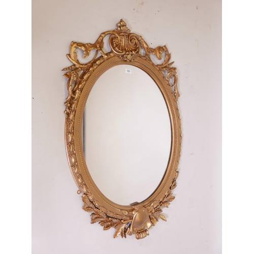 1130 - A large C19th giltwood and composition wall mirror with laurel leaf and swag decoration, 30