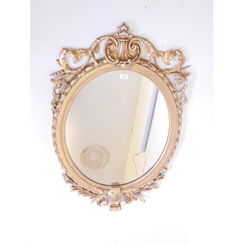 1130 - A large C19th giltwood and composition wall mirror with laurel leaf and swag decoration, 30