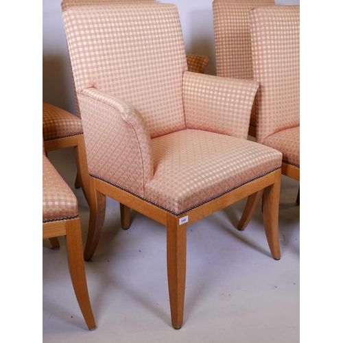 1132 - A set of six (four and two) oak framed John Lewis dining chairs, raised on sabre supports, in good c... 