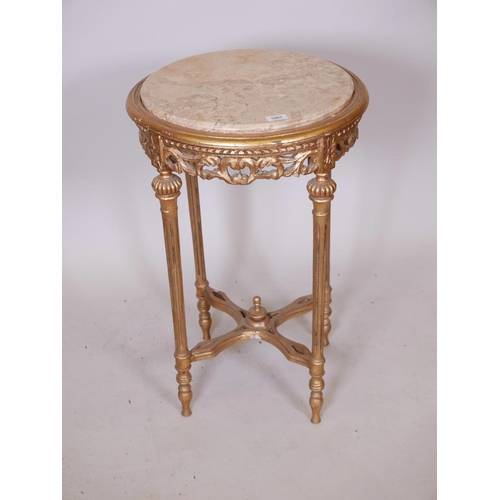 1133 - A Louis XV style giltwood occasional table with carved pierced frieze, fluted supports, pierced stre... 