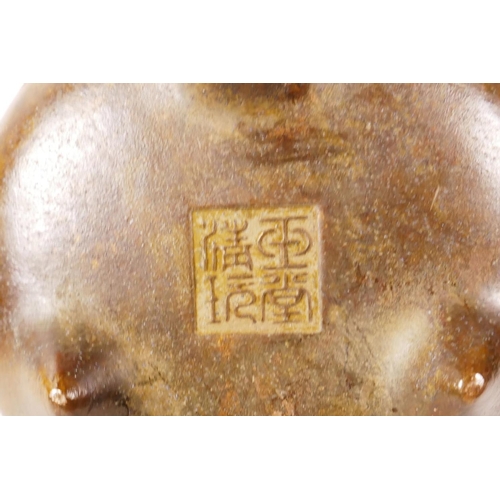 13 - A small Chinese bronze censer with two phoenix eye handles on tripod supports, impressed seal mark t... 